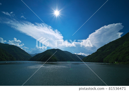 View of cumulonimbus clouds boiling over Kamikochi from Lake Azusa in summer View of cumulonimbus clouds boiling over Kamikochi from Lake Azusa in summer 81536471