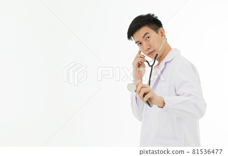 Portrait of Asian male doctor in white gown coat holding stethoscope in hand pose on white background with copy space. 81536477