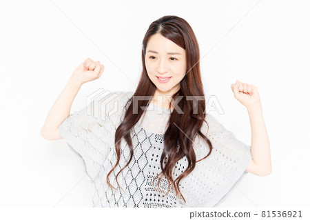 A woman in casual clothes taking a deep breath 81536921