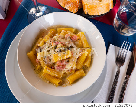 Popular dish pasta Rigatoni a la carbonara 81537075