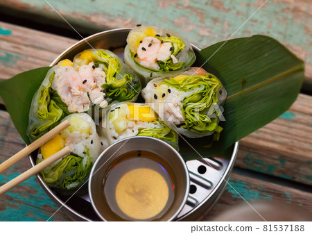 Tasty ceviche rolls from white fish with rice paper in vietnamese style Tasty ceviche rolls from white fish with rice paper in vietnamese style 81537188