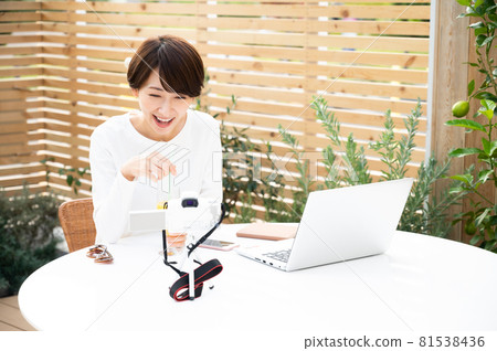 A woman recording a video outdoors A woman recording a video outdoors 81538436