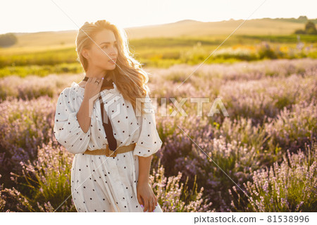 Woman in a white dress in a lavender field 81538996