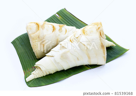 Bamboo shoots on banana leaf on white Bamboo shoots on banana leaf on white 81539168