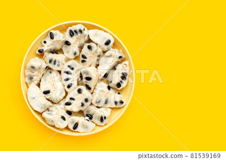 Custard apple in plate on yellow background. Custard apple in plate on yellow background. 81539169
