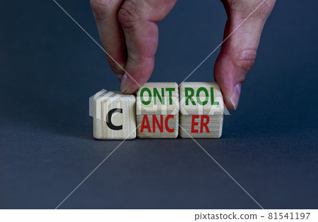 Control cancer symbol. Doctor turns wooden cubes with words 'Control cancer'. Beautiful grey background. Control cancer and medical concept. Copy space. 81541197