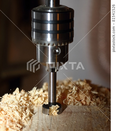Milling cutter with sawdust in action. Milling cutter with sawdust in action. 81541526
