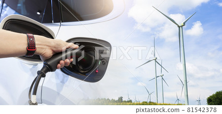 Double exposure of Hand man holding electric car charging in power station. Double exposure of Hand man holding electric car charging in power station. 81542378