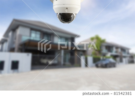 CCTV Security camera and private house blurred on the background. CCTV Security camera and private house blurred on the background. 81542381