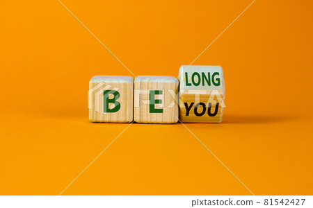 Be you, belong symbol. Turned a cube and changed words 'be you' to 'belong'. Beautiful orange background. Business, belonging and be you belong concept. Copy space. Be you, belong symbol. Turned a cube and changed words 'be you' to 'belong'. Beautiful orange background. Business, belonging and be you belong concept. Copy space. 81542427