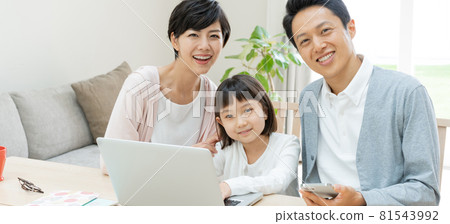 Portrait banner size of a family of three, an elementary school girl, dad, and mom 81543992