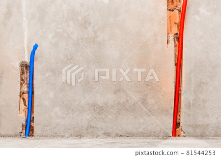 Plastic PVC pipe insulation material on construction concrete home wall repair Plastic PVC pipe insulation material on construction concrete home wall repair 81544253