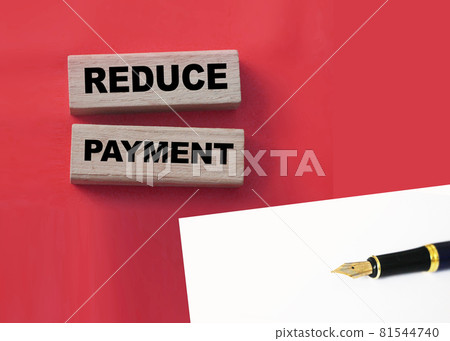Wooden blocks with the words Reduce payment. Business concept Wooden blocks with the words Reduce payment. Business concept 81544740