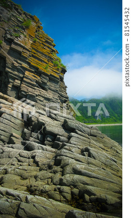 Column basalts formation of Stolbchaty cape at Kunashir, kuril islands, Russia Column basalts formation of Stolbchaty cape at Kunashir, kuril islands, Russia 81545432