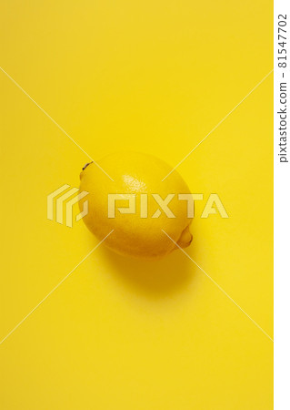 lemon isolated on yellow background 81547702