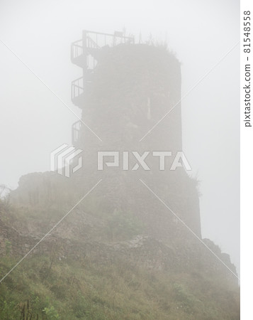 Defence tower of Lichnice castle ruin in heavy mist. Czech republic travel Defence tower of Lichnice castle ruin in heavy mist. Czech republic travel 81548558