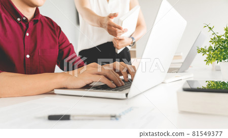 Young woman and man studying for a test or exam Tutor books with friends catching up and learning, education and school concept. 81549377