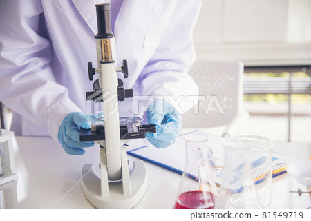 Woman scientist in lab look at science microscope medical test and research biology chemistry. Females technician laboratory analyzing scientific pharmacy genetic research. Chemistry Medical test lab 81549719