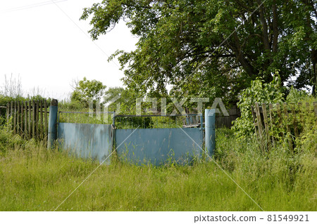 Beautiful old gate from abandoned house in village 81549921