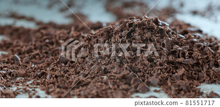Grated chocolate close-up. The blank for the cake. The background in blur. 81551717