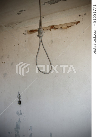 Deadly loop hanging from the ceiling in abandoned apartment. Concept of suicide, despair 81551771