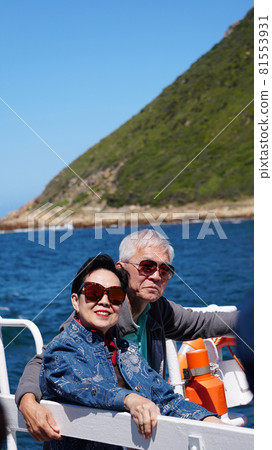 Asian senior elderly couple on tourist ferry boat to seals islan 81553931