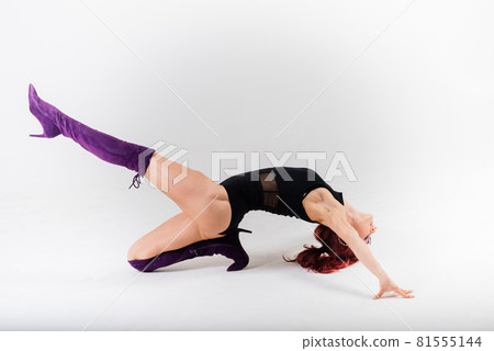 Sexy pole redhead dancer showing her body. 81555144