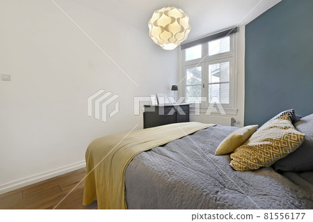 Interior of a cozy and bright bedroom with beautiful decoration Interior of a cozy and bright bedroom with beautiful decoration 81556177