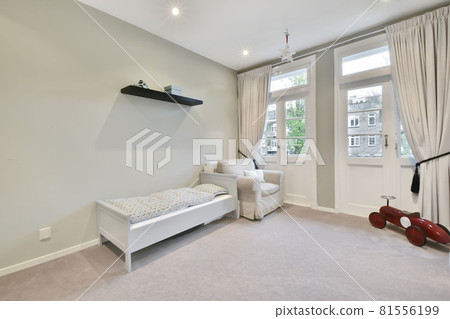 Interior of a cozy and bright bedroom with beautiful decoration 81556199