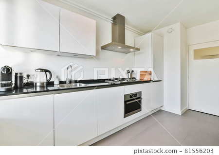 Beautiful and spacious kitchen in an elegant home 81556203