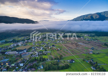 Beautiful and magnificent sea of clouds in the morning sun and the cityscape of Hakuba Village Hakuba Village, Nagano Prefecture (aerial view by drone) Beautiful and magnificent sea of clouds in the morning sun and the cityscape of Hakuba Village Hakuba Village, Nagano Prefecture (aerial view by drone) 81559110