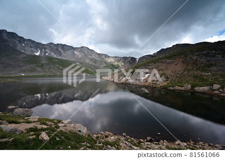 Summit Lake on Mount Evans, Colorado under dramatic summer cloudscape. 81561066