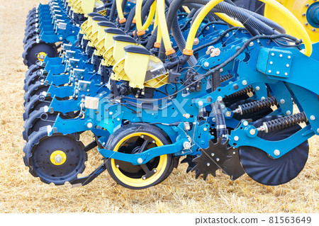 Modern blue multi-row seeder used in the agricultural sector. Modern blue multi-row seeder used in the agricultural sector. 81563649