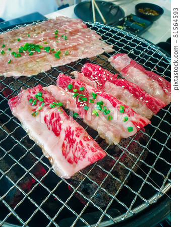 Grilled raw meat cooking on wagyu grill Grilled raw meat cooking on wagyu grill 81564593
