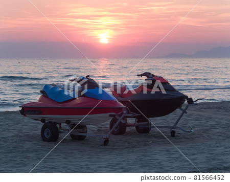 power boats (jet ski) on the beach at sunset power boats (jet ski) on the beach at sunset 81566452