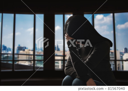 woman sit Depression Standing by window woman sit Depression Standing by window 81567040