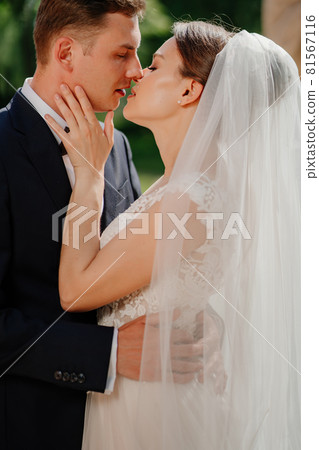 kiss. lovers and happy bride and groom. romance and tenderness in relationships. kiss. lovers and happy bride and groom. romance and tenderness in relationships. 81567116