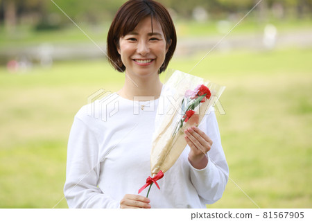 A woman with carnation A woman with carnation 81567905