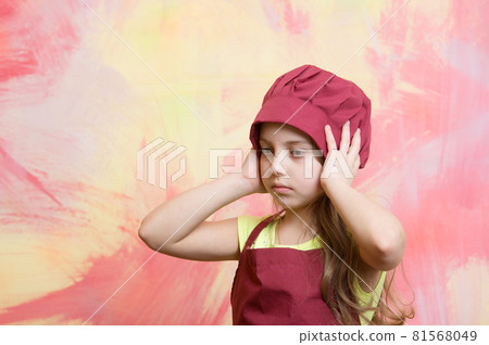 kid, serious girl cook in red chef hat, apron kid, serious girl cook in red chef hat, apron 81568049