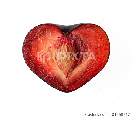 Heart shaped half of juicy ripe black plum with stone isolated on white background. 81568747