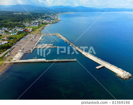 Aerial view of the scenery of Kakeno fishing port in Mori-cho, Hokkaido in summer Aerial view of the scenery of Kakeno fishing port in Mori-cho, Hokkaido in summer 81569198