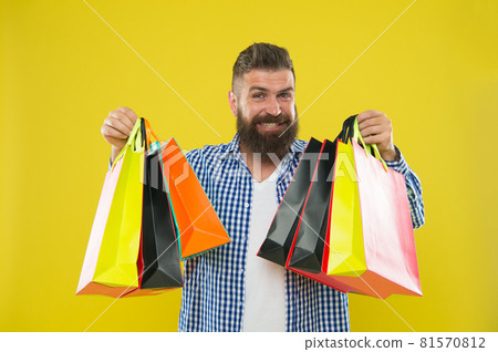 Man bearded hipster cheerful face carry paper shopping Man bearded hipster cheerful face carry paper shopping 81570812
