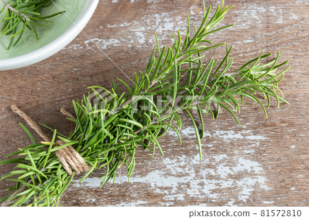 Rosemary branches cut on rustic background 81572810
