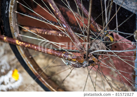 old wet rused brown bicycle after rain closeup with selective focus and blur old wet rused brown bicycle after rain closeup with selective focus and blur 81572827