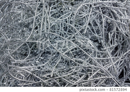 Long curly aluminium chips pattern background with selective focus 81572894