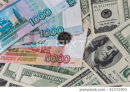 us dollars and russian rubles close-up background with selective focus us dollars and russian rubles close-up background with selective focus 81572903