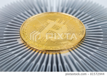 Bitcoin shiner close-up on aluminium heatsink with selective focus 81572944