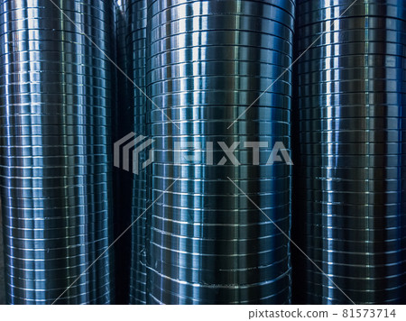 industrial manufacturing background of columns of shiny metal rings after cnc turning operation 81573714