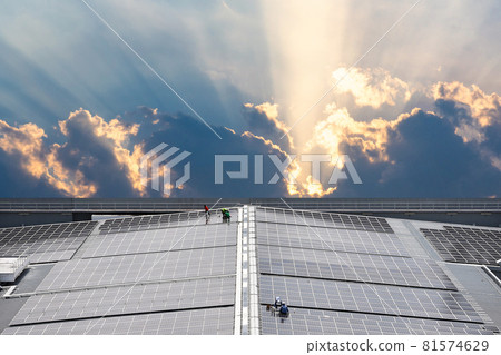 Engineering install Solar Cell system on a Roof top of the building to absorb sunlight as a source to generate electricity. Engineering install Solar Cell system on a Roof top of the building to absorb sunlight as a source to generate electricity. 81574629
