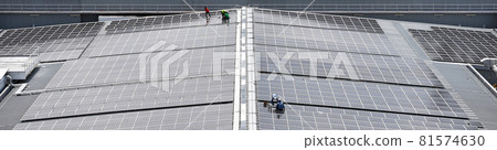 Engineering install Solar Cell system on a Roof top of the building to absorb sunlight as a source to generate electricity. Engineering install Solar Cell system on a Roof top of the building to absorb sunlight as a source to generate electricity. 81574630